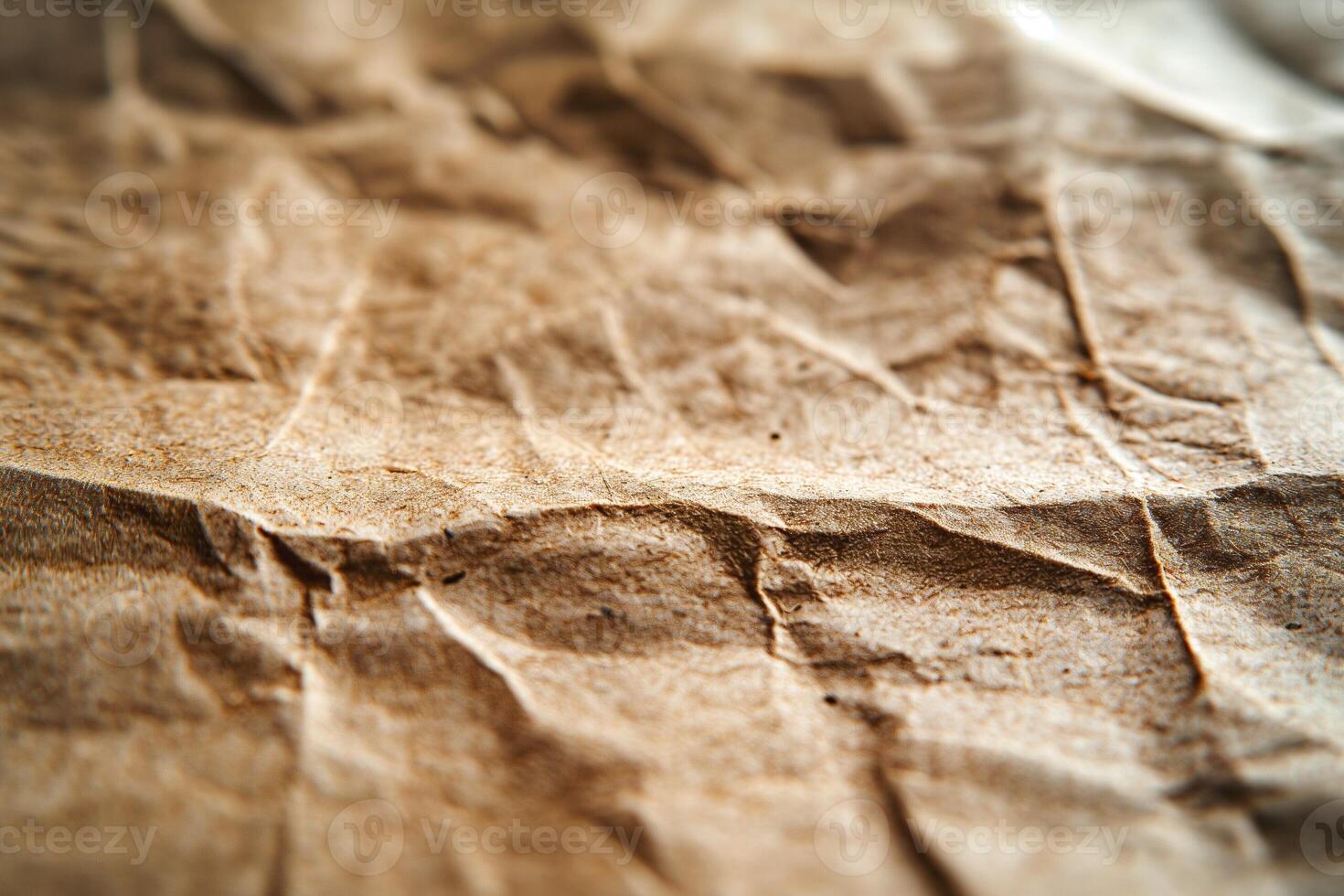 Textured close-up of crumpled brown paper, highlighting its rich details and unique creases. photo
