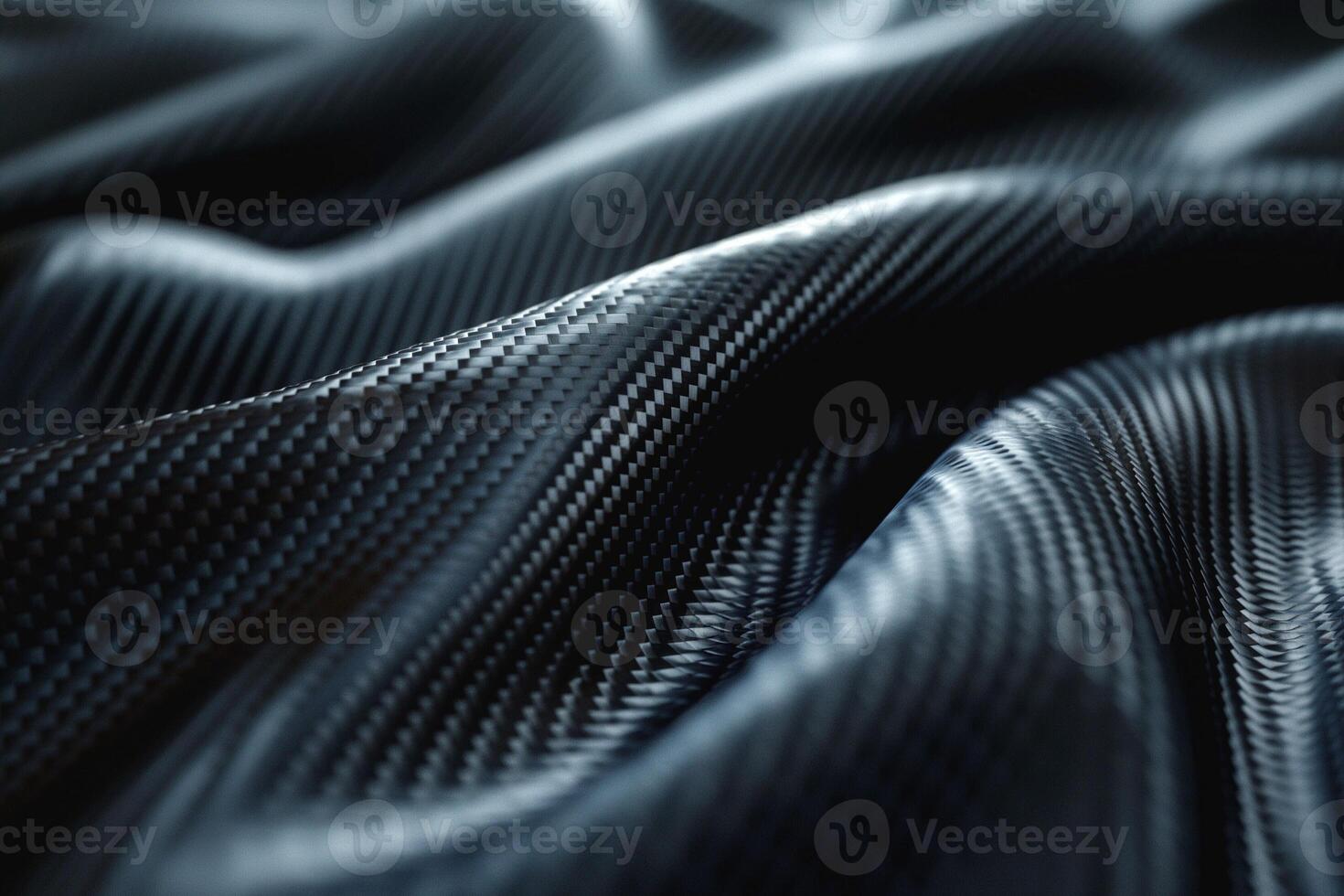 Close-up of textured black fabric resembling carbon fiber, showcasing intricate patterns and curves. photo