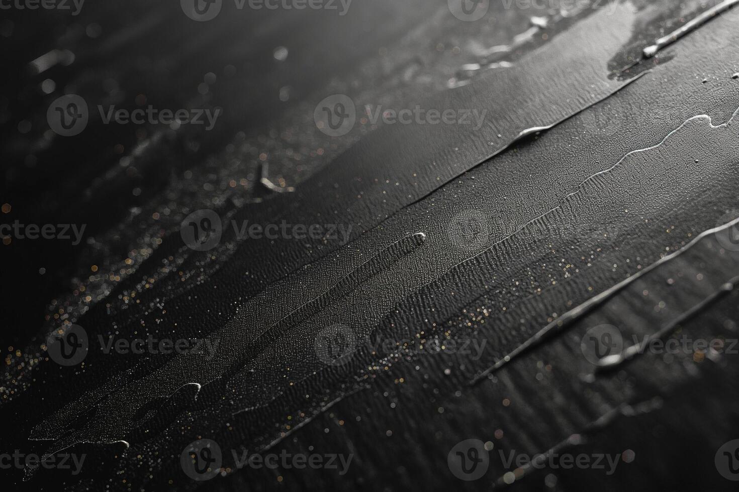Abstract close-up of smooth black liquid flowing on a textured surface, creating a sleek and modern aesthetic. photo