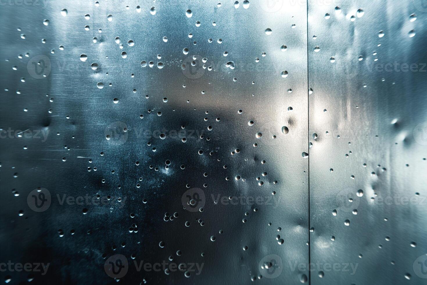 Close-up of water droplets on a metallic surface, creating an intriguing abstract pattern. photo
