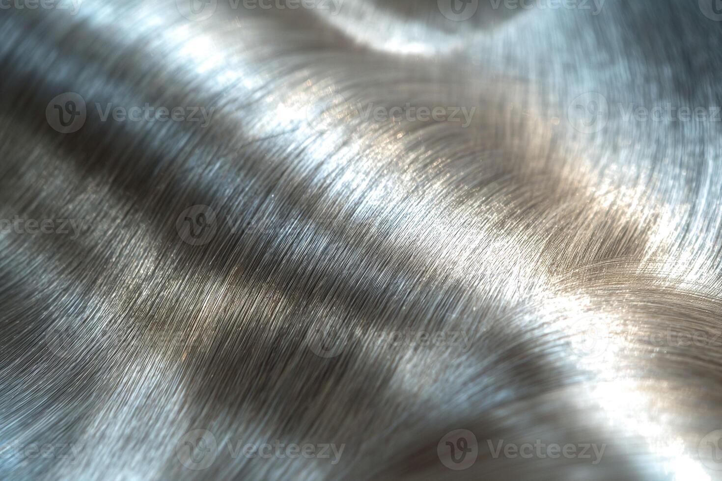 Close-up of shimmering brushed metal surface showing delicate textures and reflections. photo