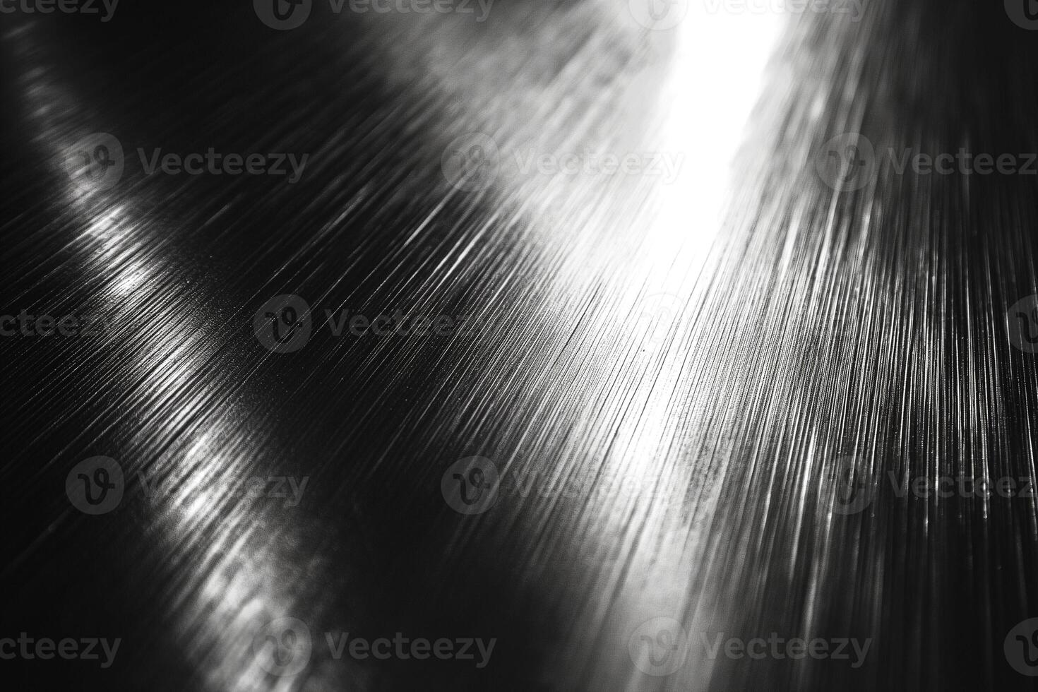 Close-up shot of a metallic surface featuring reflective lines and a sleek texture. photo