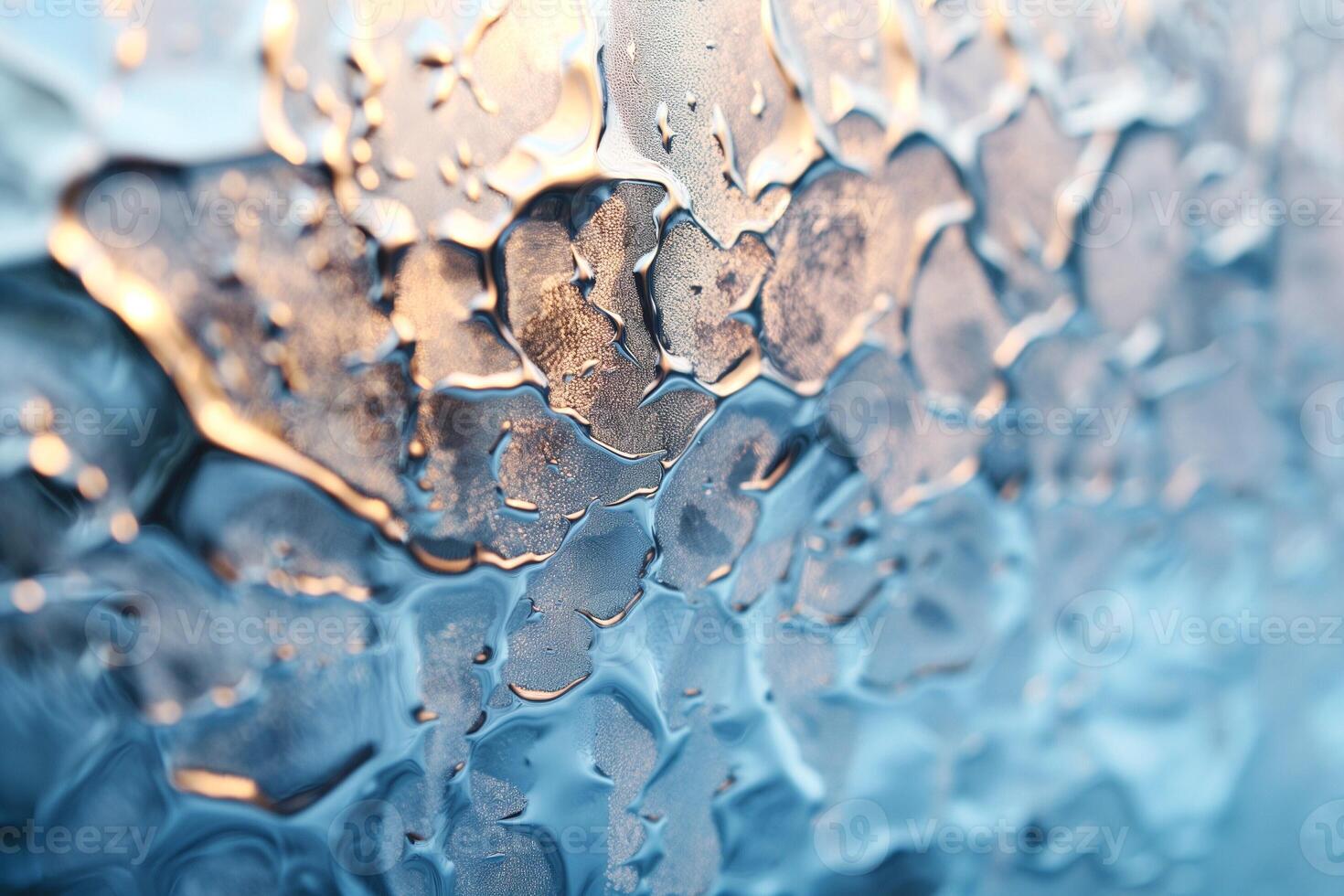 Close-up of condensation on glass, showcasing shimmering droplets and a soft blue hue. photo