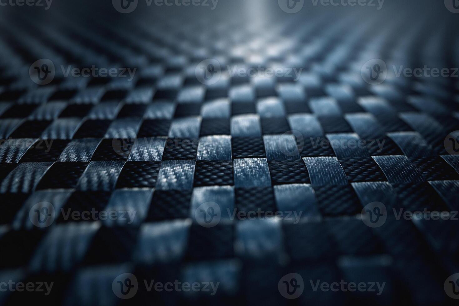 Close-up of a textured black woven surface, showcasing intricate patterns and light reflections. photo