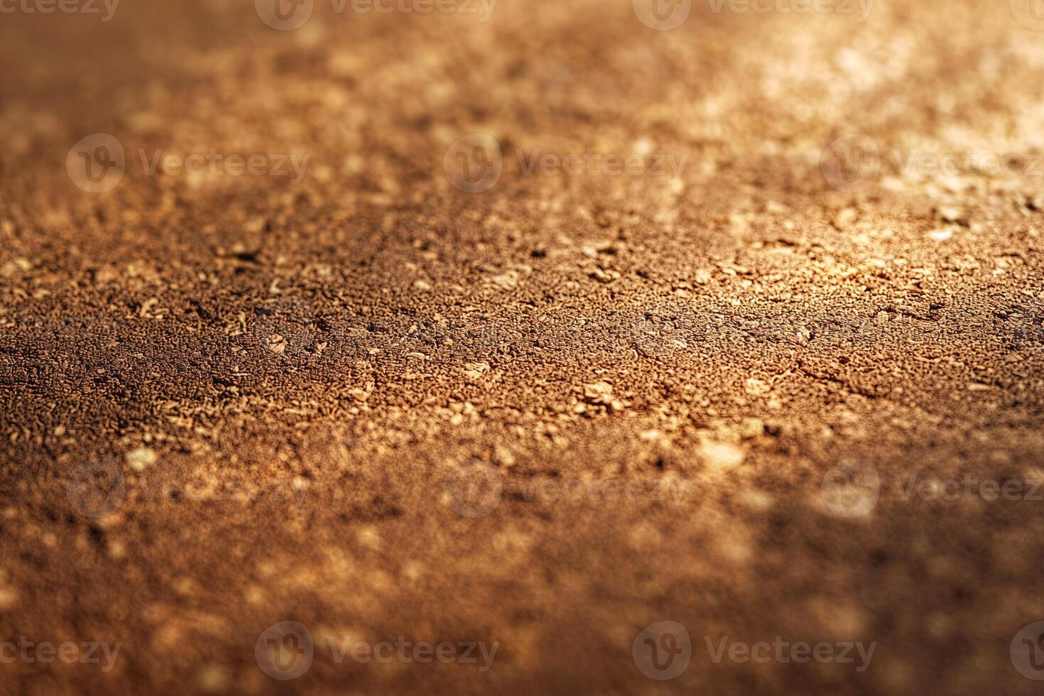 Beautifully textured close-up of a rich, earthy brown surface with a warm, glowing quality. photo