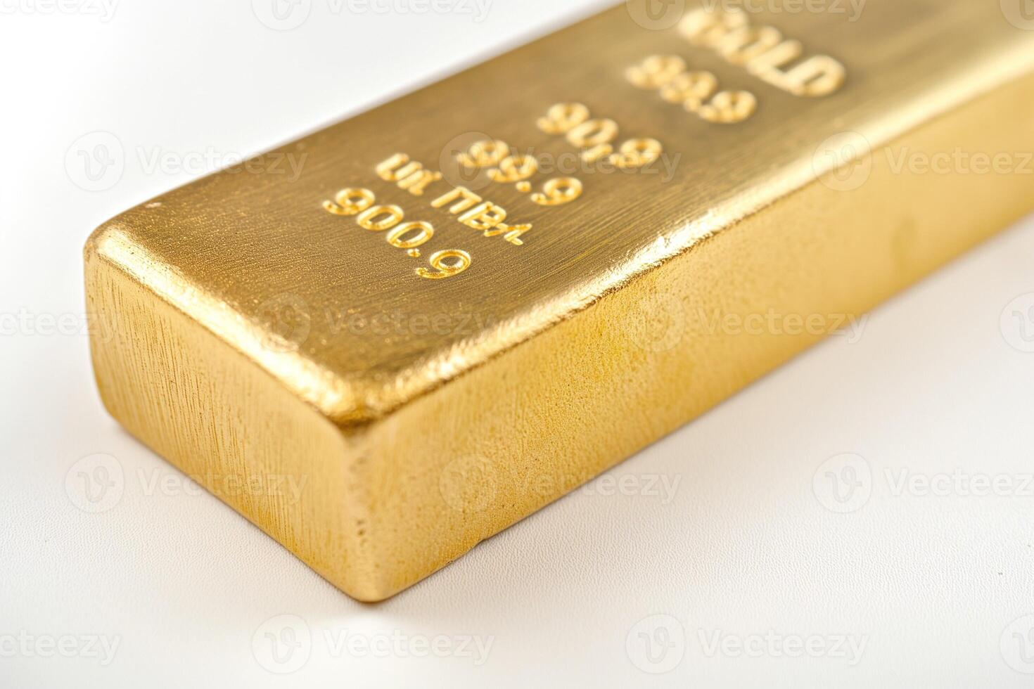 A close-up of a gold bullion bar, showcasing its shimmering surface and engraved details, symbolizing wealth and prosperity. photo