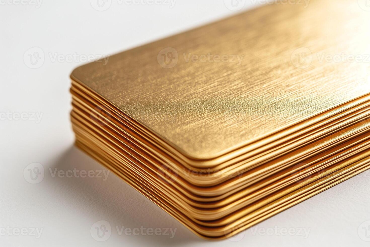A close-up of neatly stacked, shiny gold-toned metal plates, exuding luxury and elegance. photo