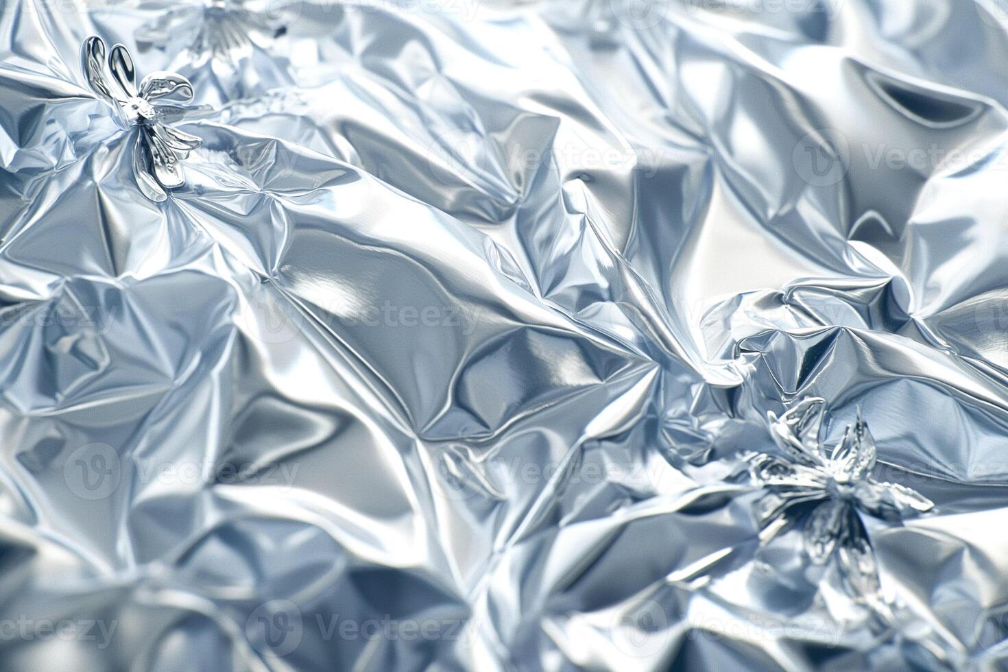 A close-up view of crumpled silver foil, showcasing its shiny, reflective texture and intricate details. photo