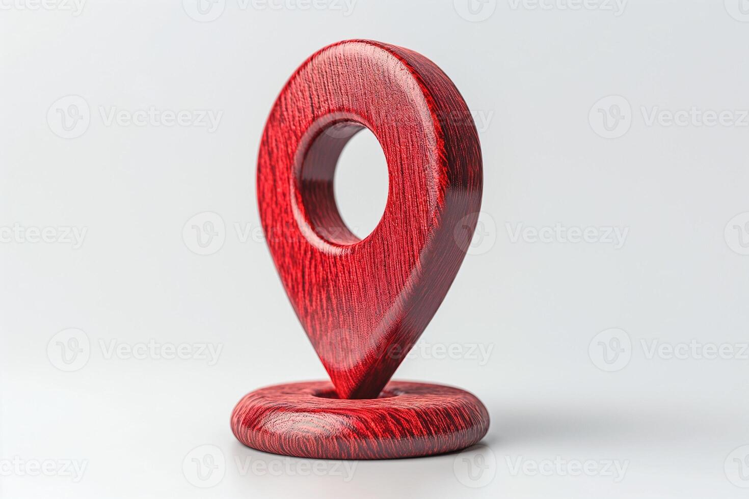 A striking red wooden location pin symbol, perfect for representing navigation and mapping. photo