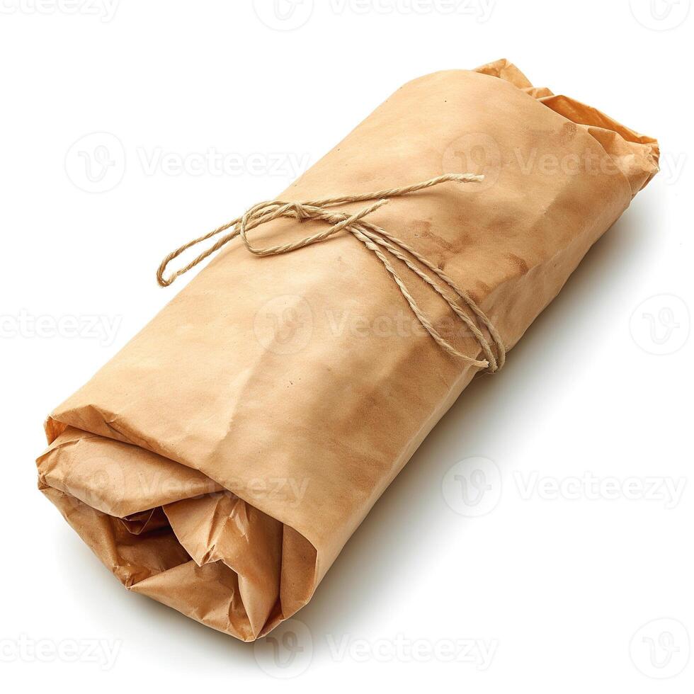 A neatly wrapped parcel made of brown paper, tied with twine, evoking a rustic and vintage aesthetic. photo