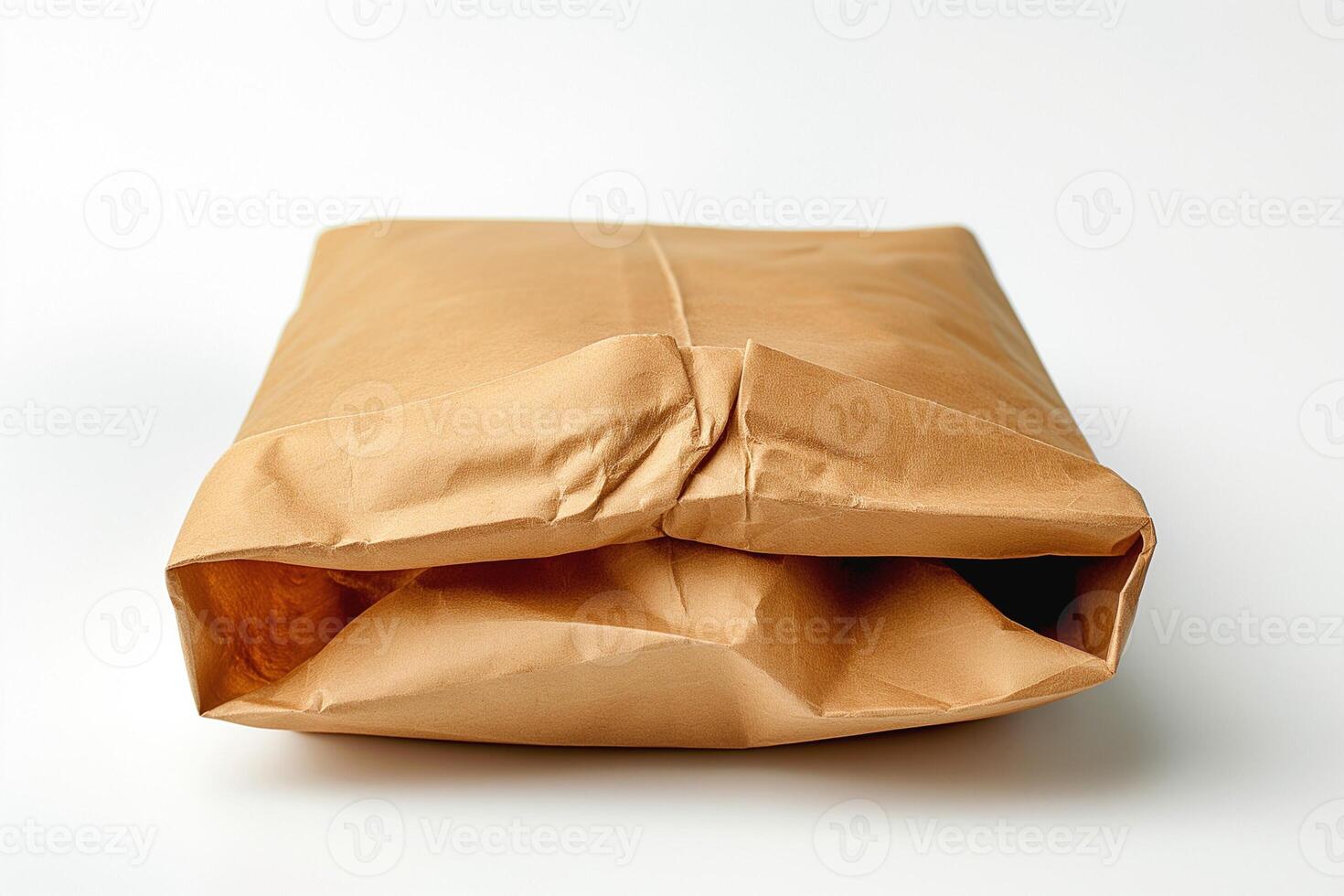 A neatly folded brown paper package, showcasing a minimalist aesthetic on a clean background. photo