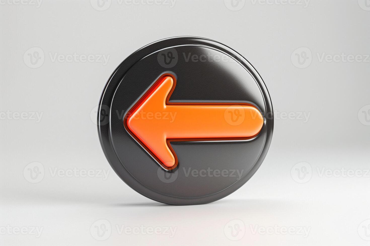 A bold, black circular button featuring a prominent orange left arrow, symbolizing direction and navigation. photo