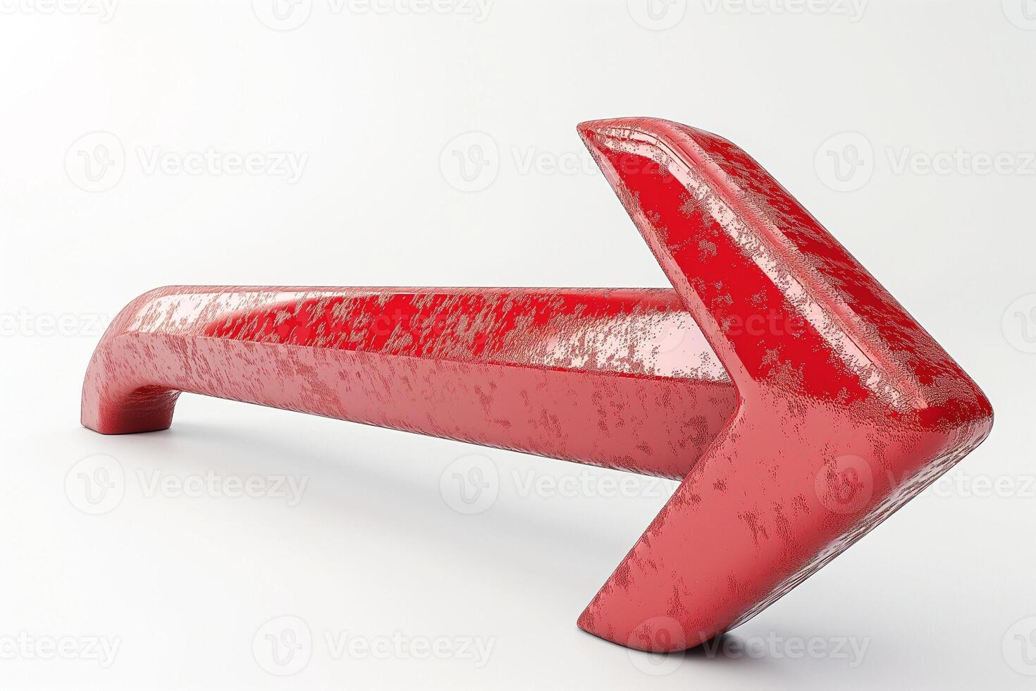 A bold, glossy red arrow pointing left, symbolizing direction and movement. photo