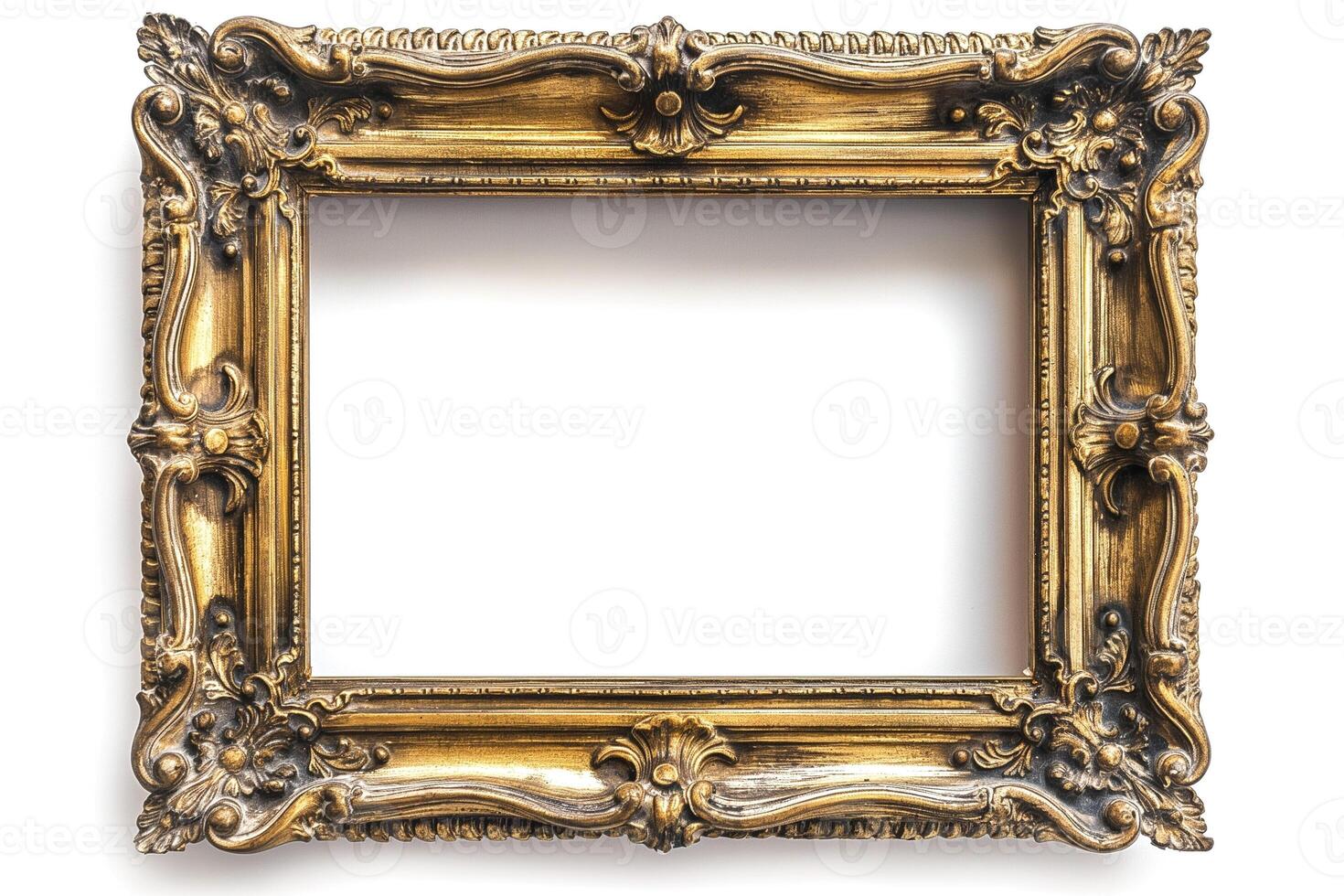 An ornate, vintage-style gold picture frame, intricately designed with floral motifs and curls. photo