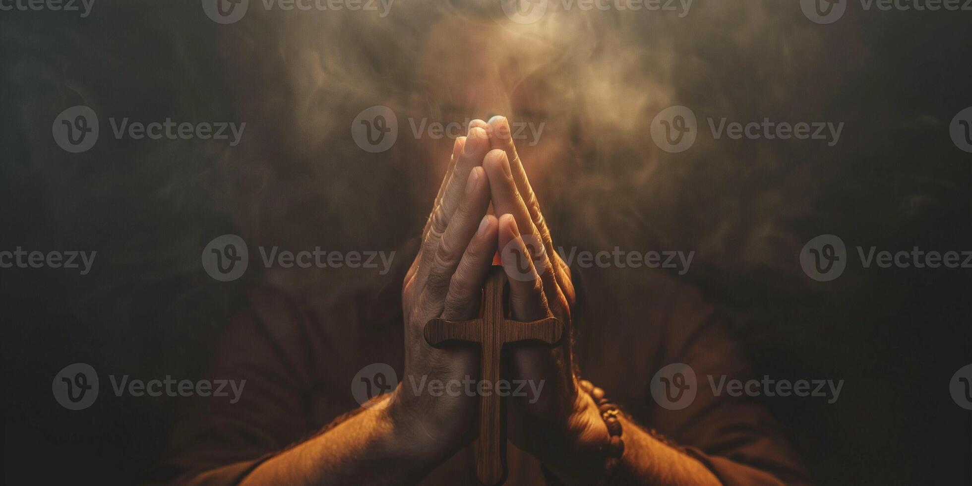 A man of middle age, with light skin, clasping his hands in prayer with a wooden cross, surrounded by ethereal smoke. photo