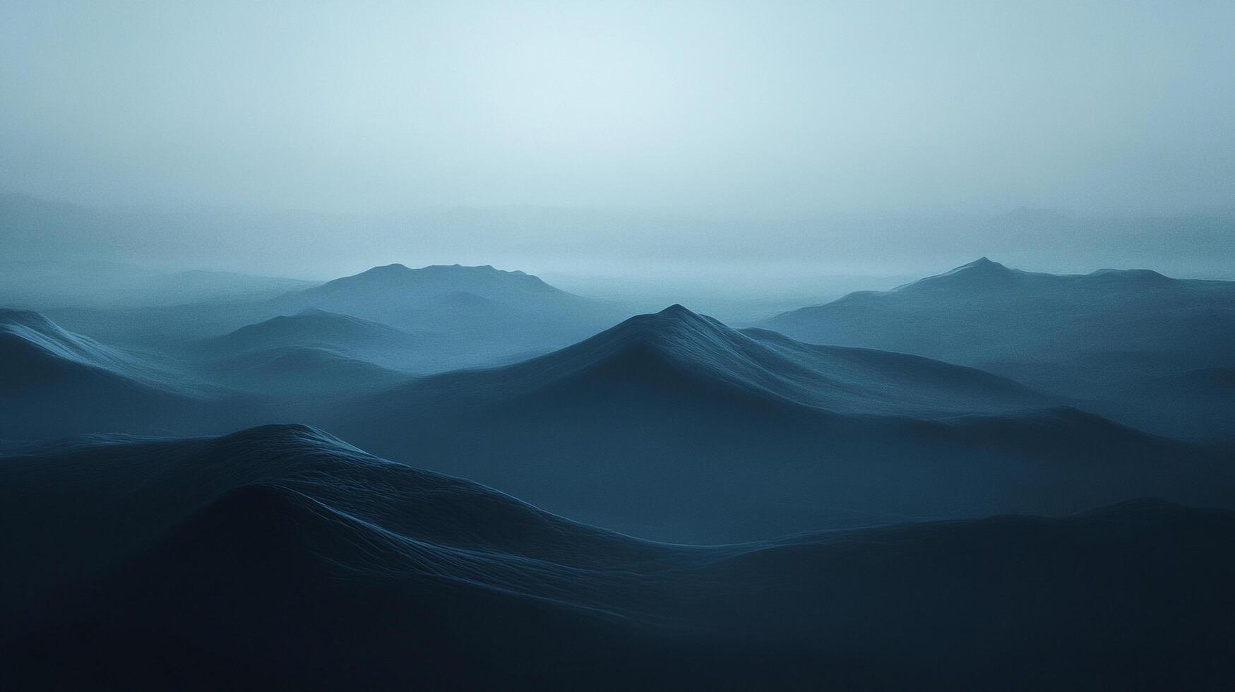 Monochromatic mountain landscape in cool tones. Peaks rise through mist in a serene, minimalist scene. photo