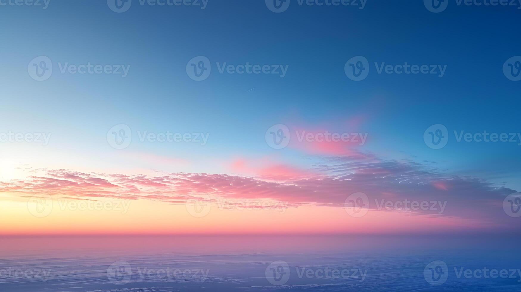 Blue sky with pink clouds over the ocean at sunset photo