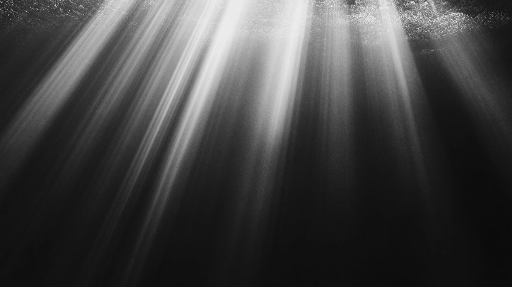 Sunbeams pierce through the water, creating a serene and ethereal underwater scene, light shafts cutting through the darkness. photo