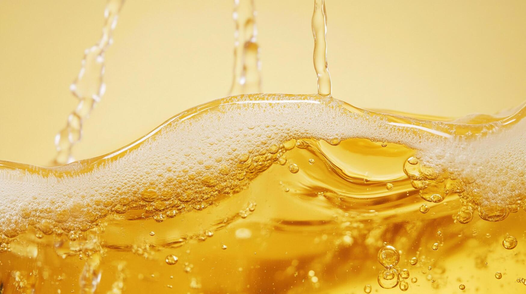 Golden liquid cascading down with effervescence and bubbles, creating a visual texture and inviting the viewer into a world of refreshment. photo