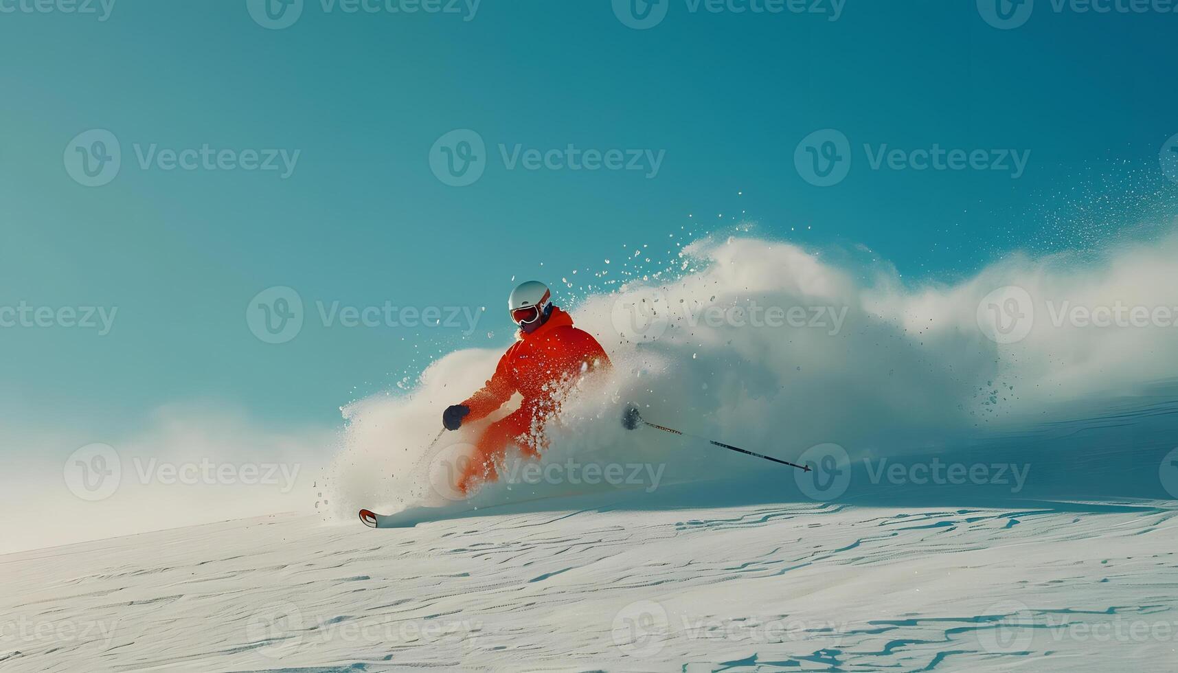 Skier gliding down snowy slope on skis in scenic landscape photo