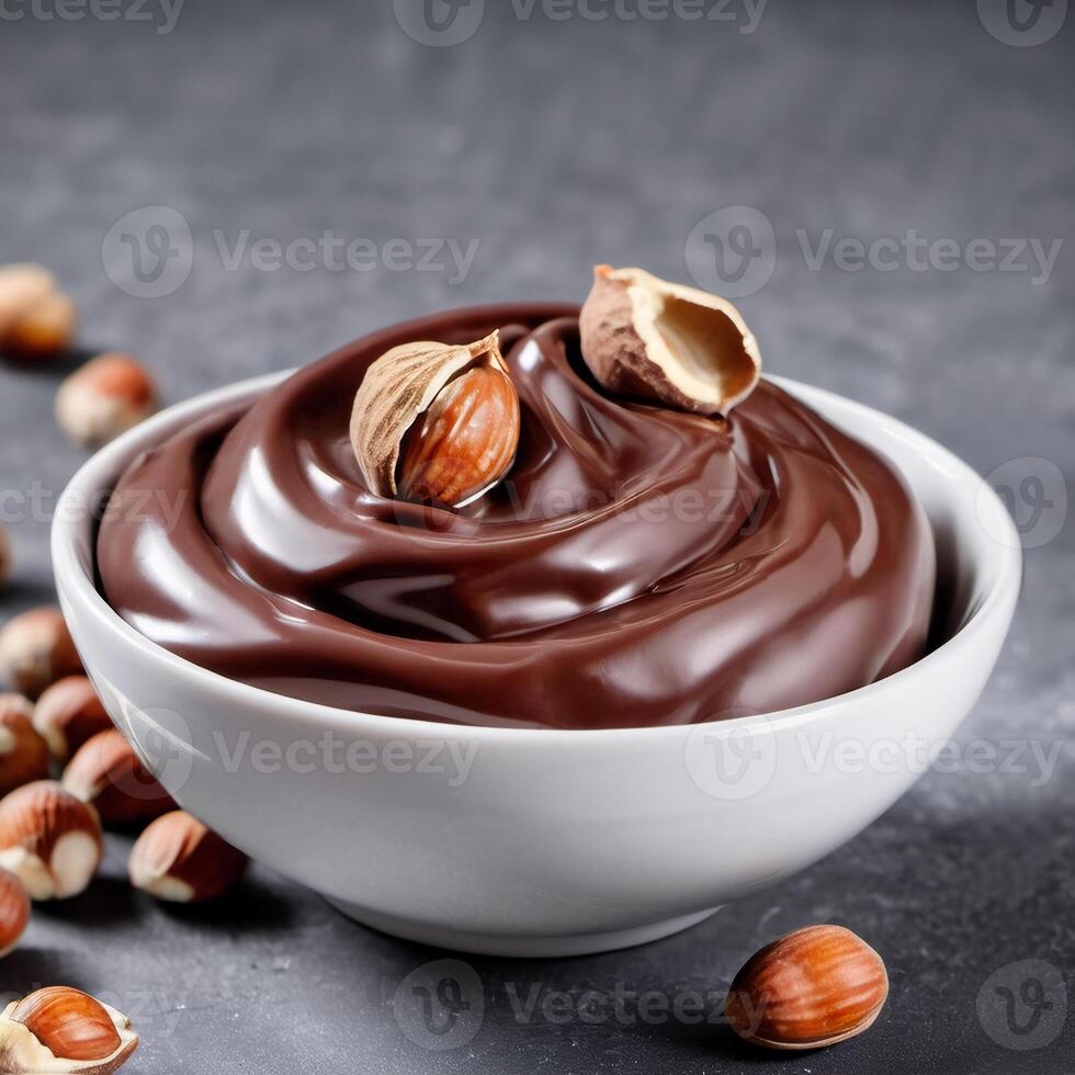 Chocolate cream with hazelnut, soft paste in a bowl. Dark chocolate, cocoa. Close-up food image. Design element photo
