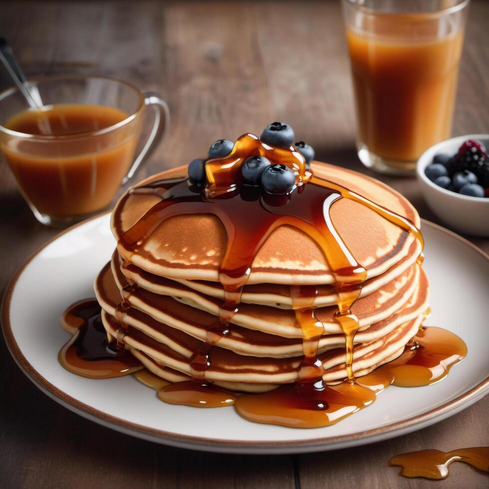 Pancakes with liquid honey or maple syrup, decorated with fresh blueberries. Close-up view of a stack of delicious pancakes. Macro photo of food for advertising