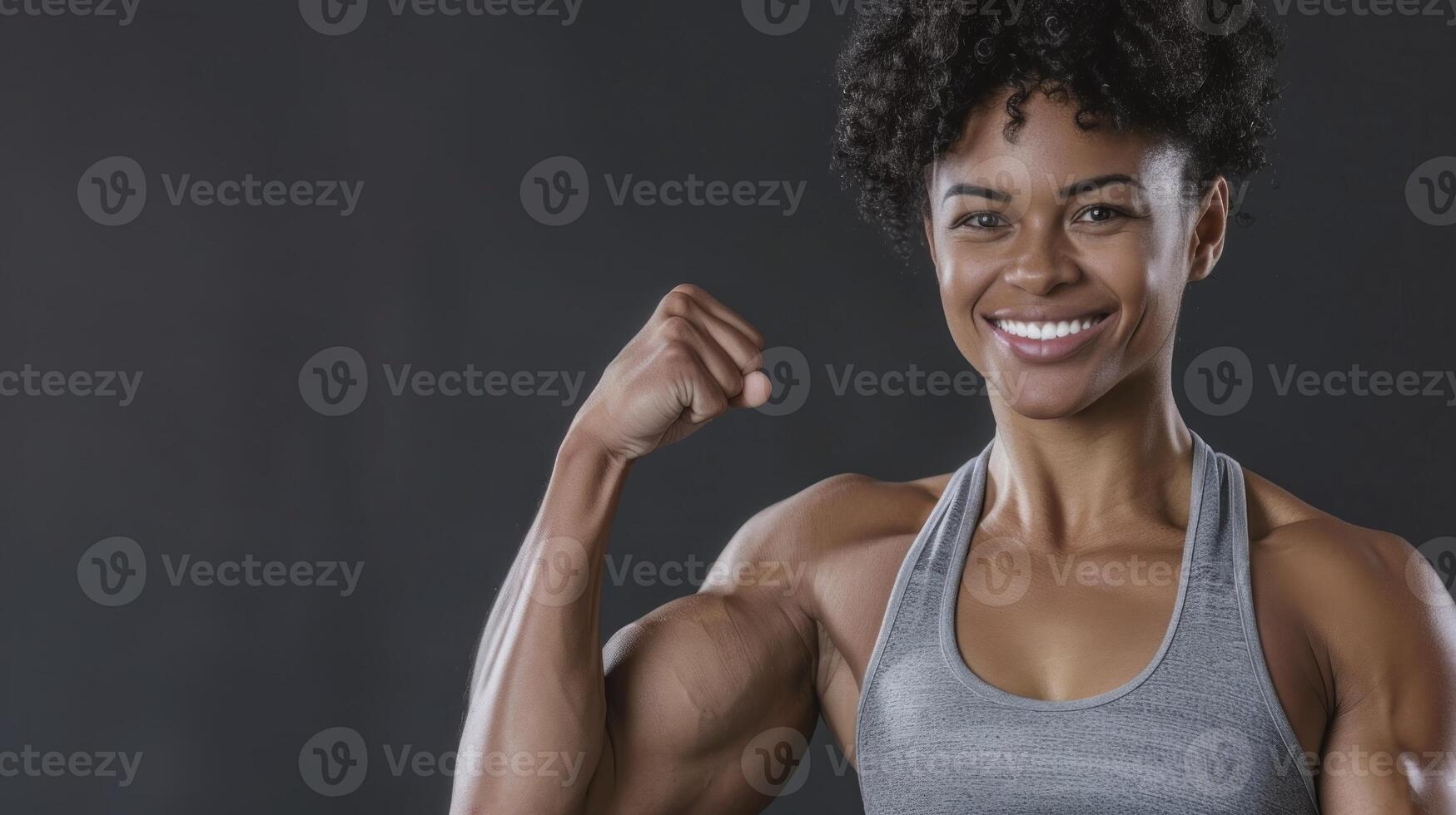 A woman with a muscular body showing off her muscles photo