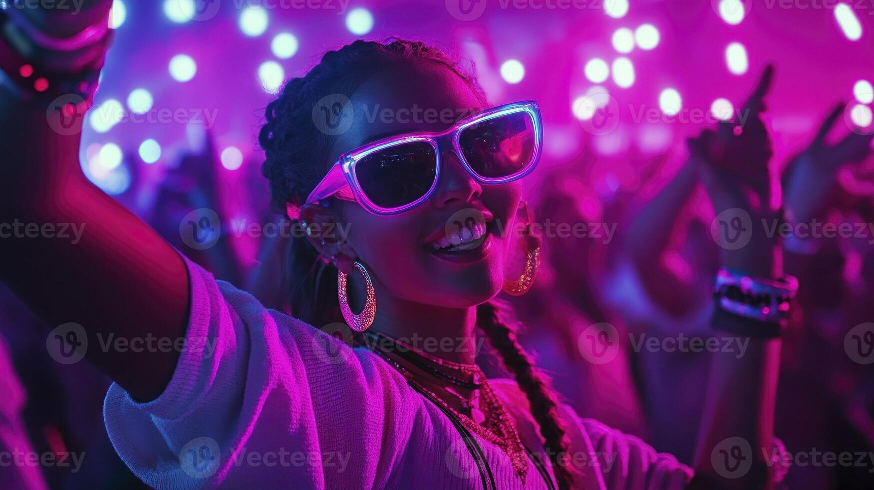 A woman wearing sunglasses at a party photo