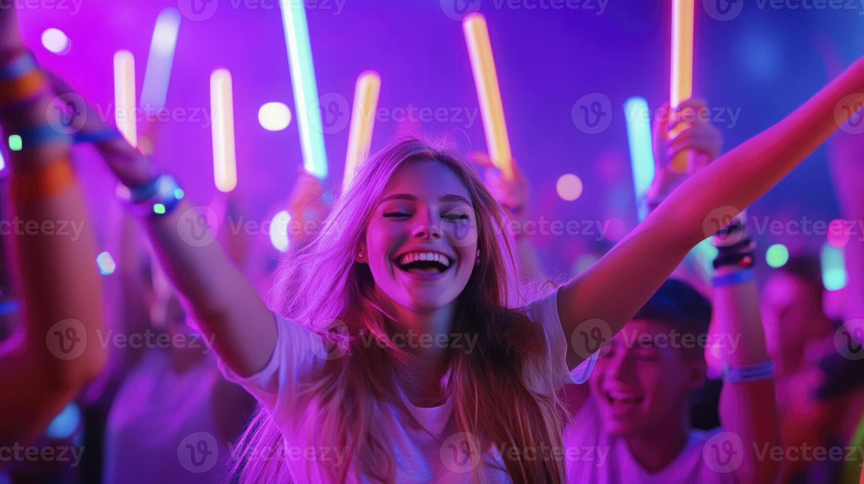 A woman with neon lights in her hands at a party photo
