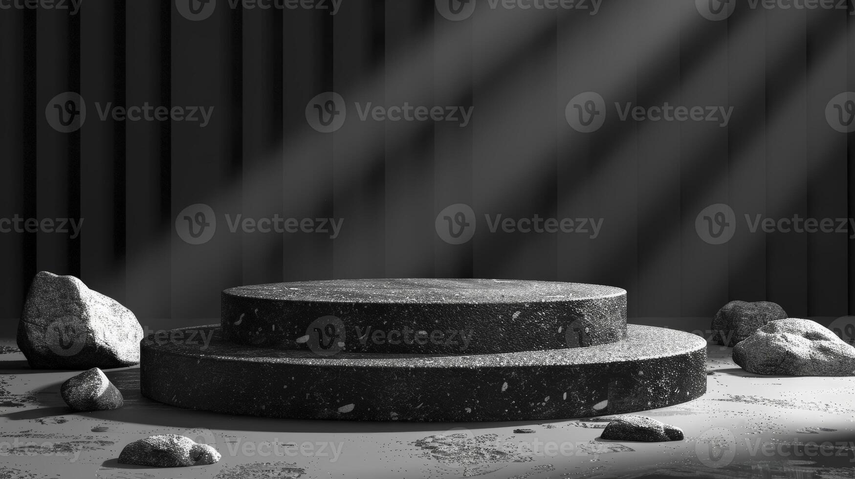 Black and white photo of a stage with rocks and a spotlight
