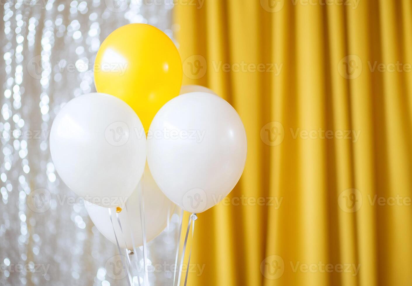 A cluster of white and yellow balloons against a golden backdrop. photo