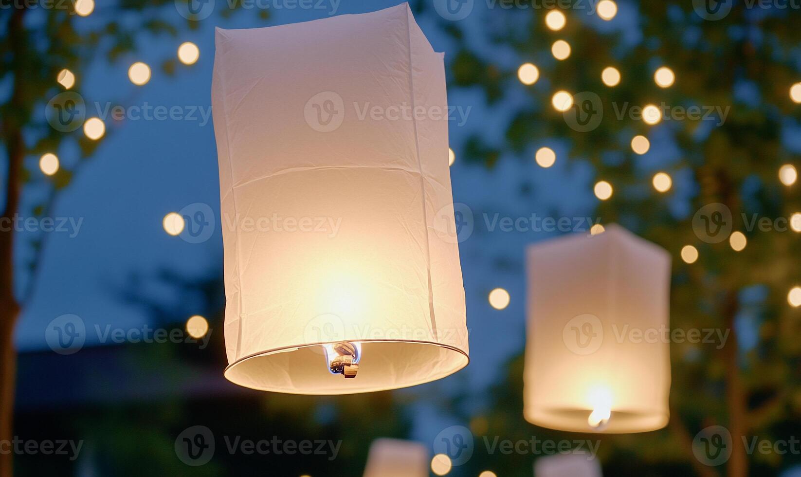 Lanterns glowing softly in a twilight setting, creating a festive ambiance. photo