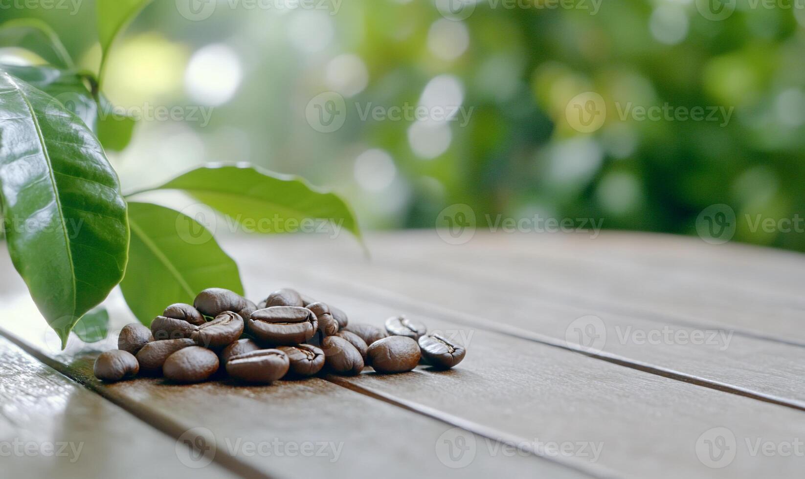 A close-up of coffee beans and leaves on a wooden surface. photo