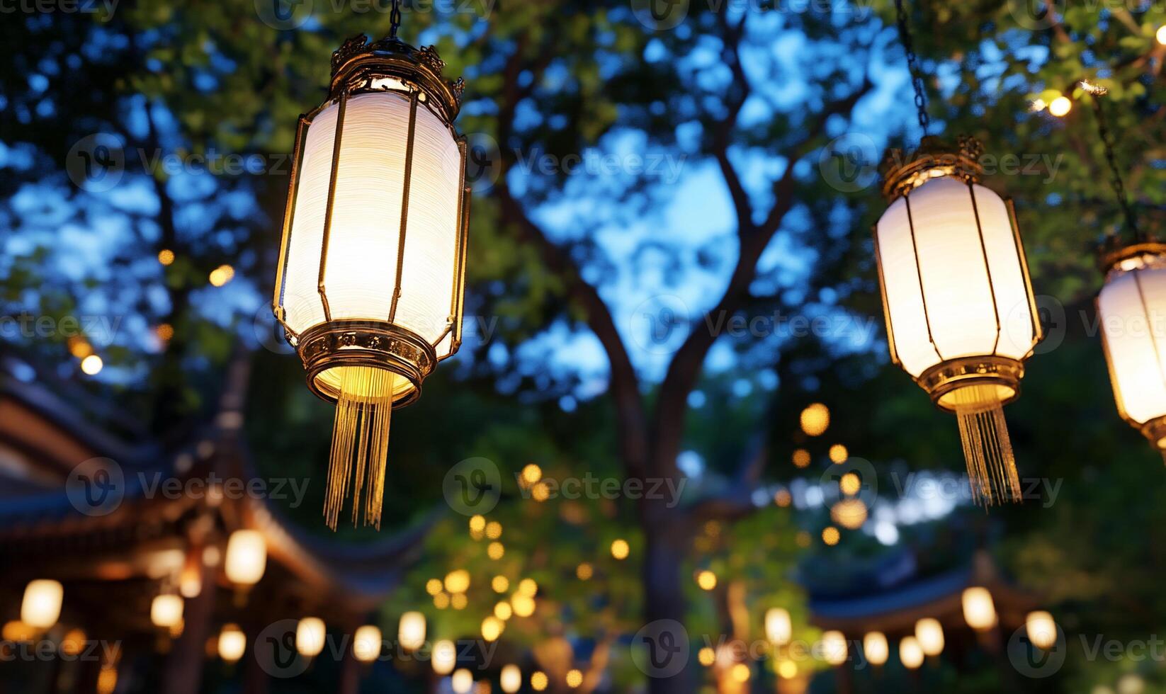 Lanterns illuminate a serene outdoor setting at dusk. photo