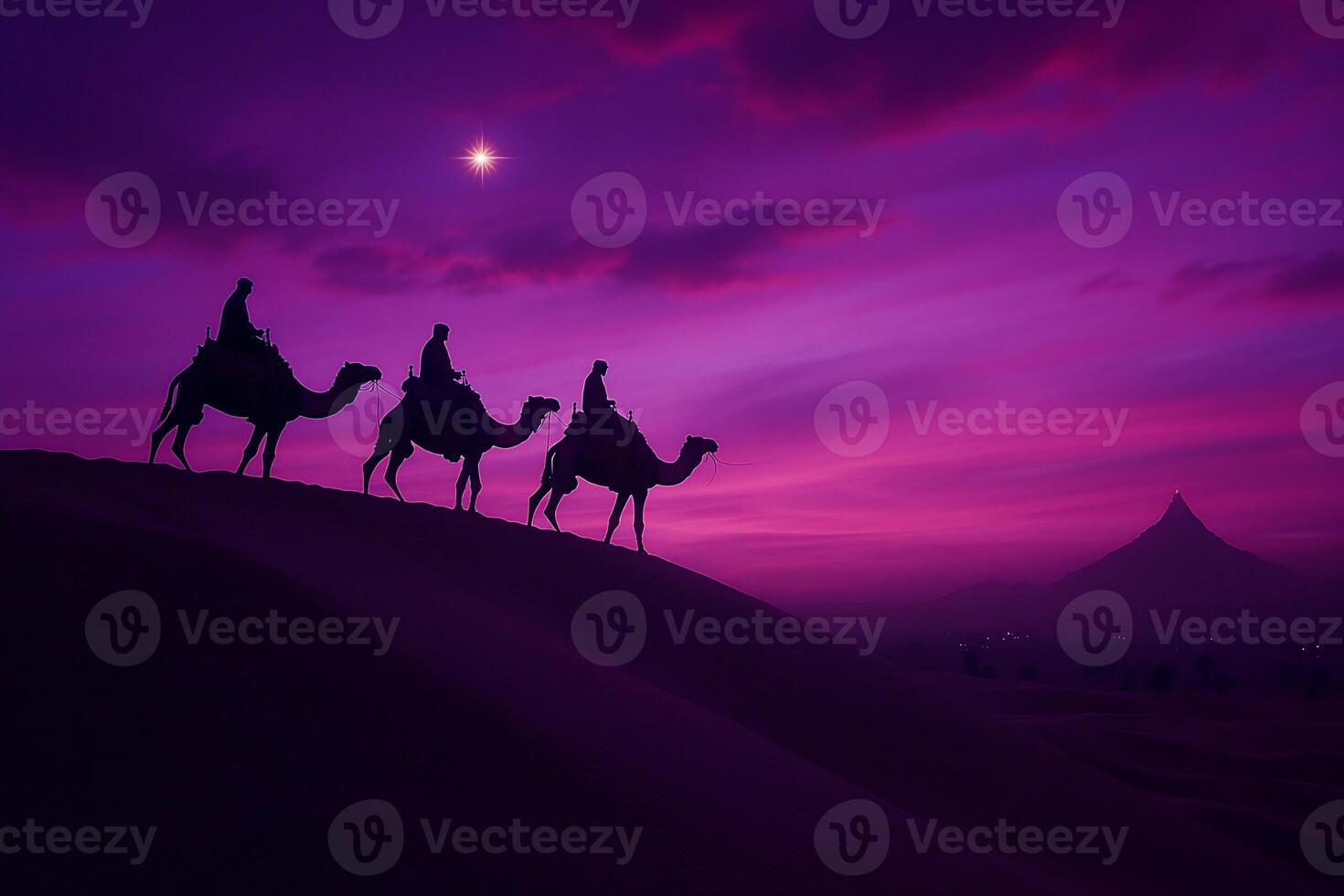 Silhouetted camels and riders against a vibrant, twilight desert sky. photo