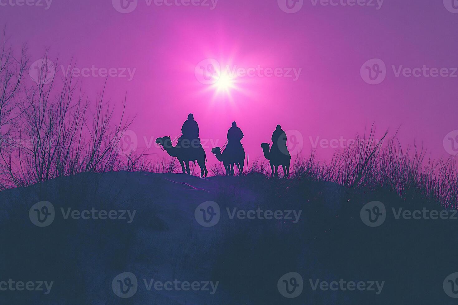 Three people on camels are silhouetted against a purple sky photo