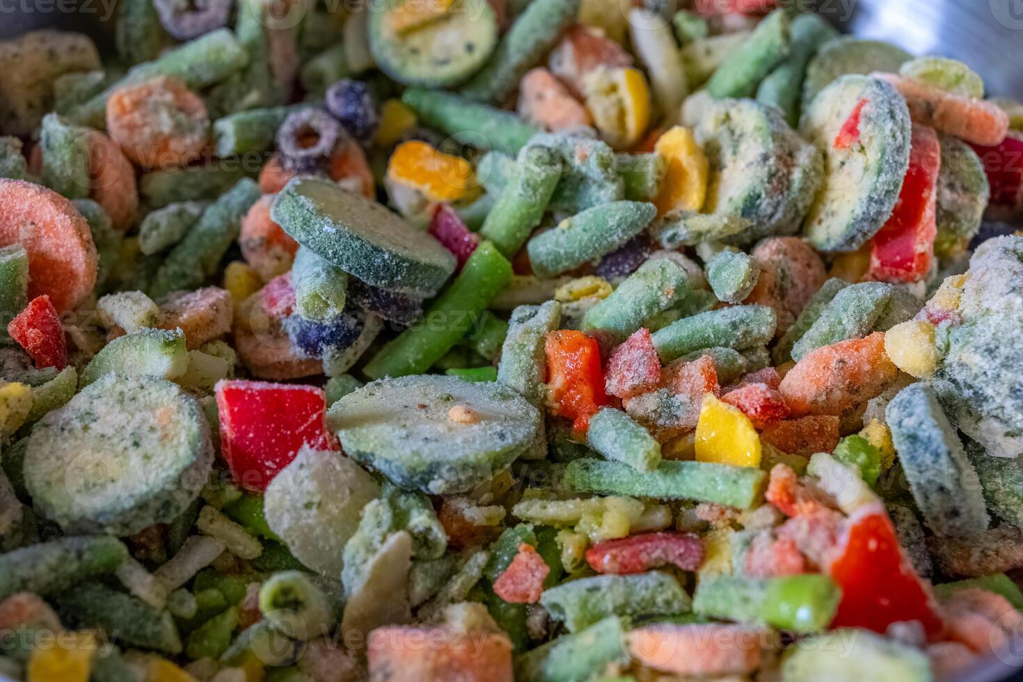 Colorful assortment of frozen vegetables ready for cooking in a kitchen setting photo