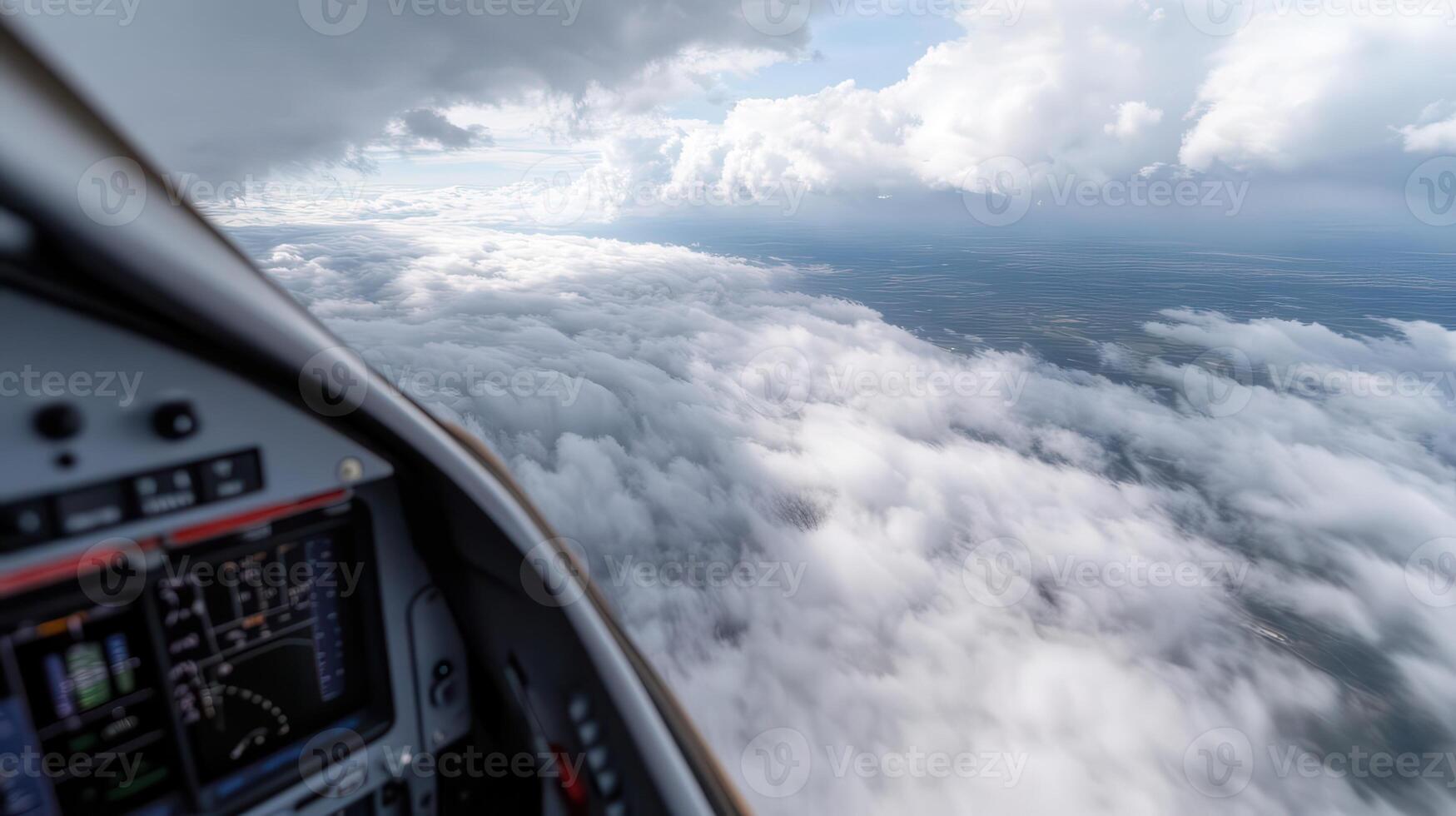 A view from inside a plane looking out at the clouds photo