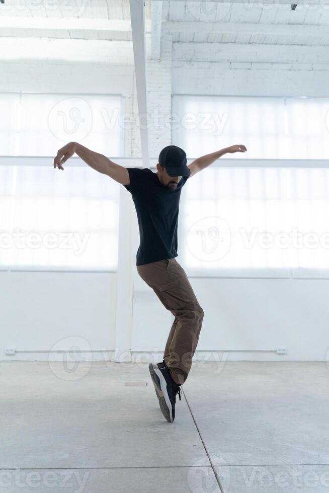 Dynamic and Energetic Dance Movement in a Vibrant Urban Studio Setting with Artistic Flair photo