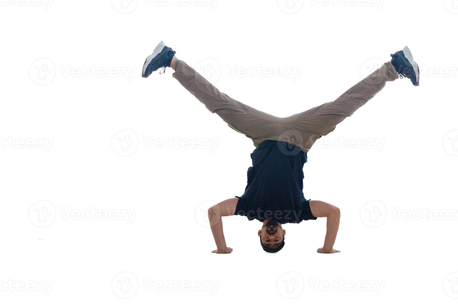 A Dynamic Handstand Move Performed by a Young Man, Showcasing Incredible Skill and Balance photo