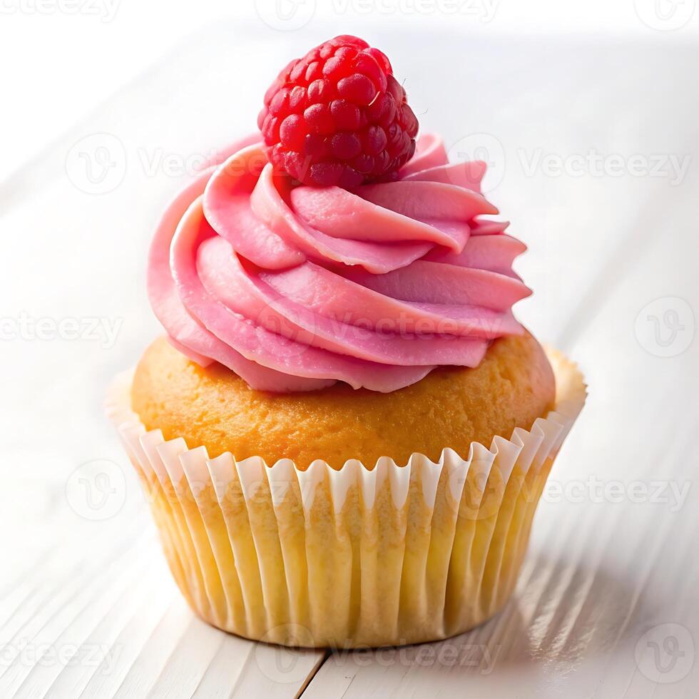 A cupcake with a raspberry on top photo