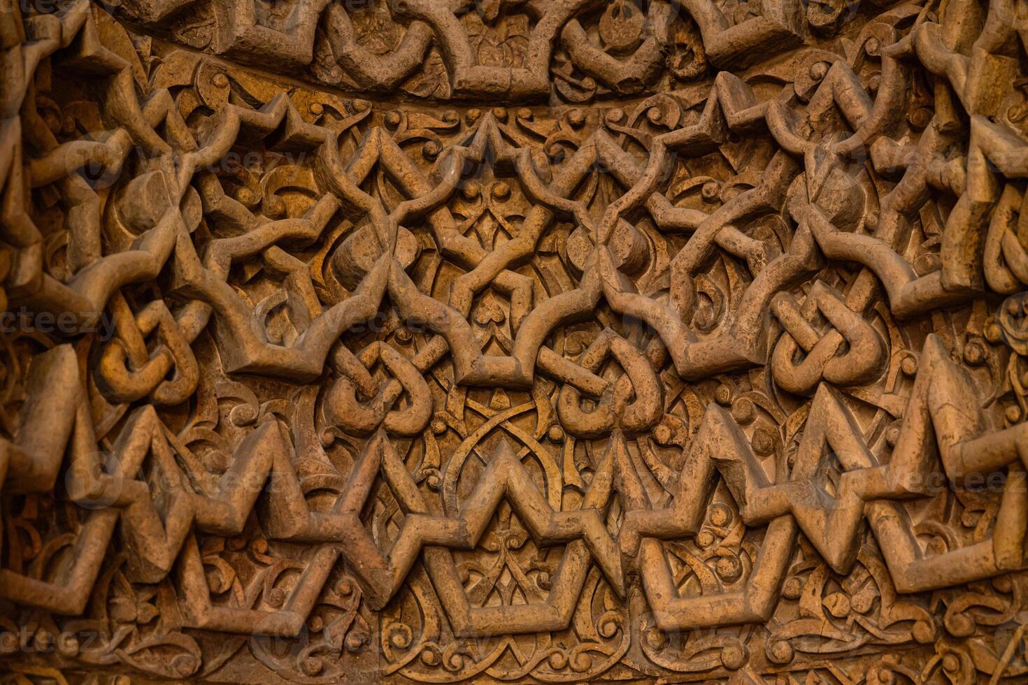Details of the carved stone decoration of the mihrab of Great Mosque of Divrigi photo