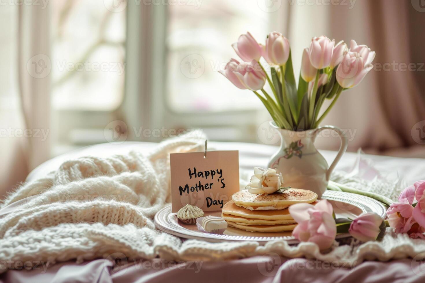 Mothers Day breakfast in bed with pancakes and flowers photo