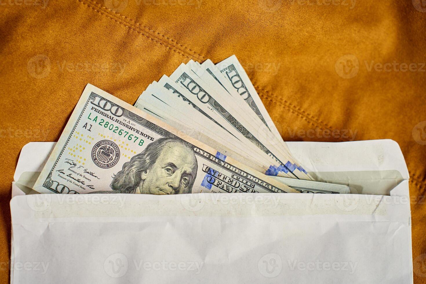 Dollar bills in envelope. Corruption and illegal cash payments photo