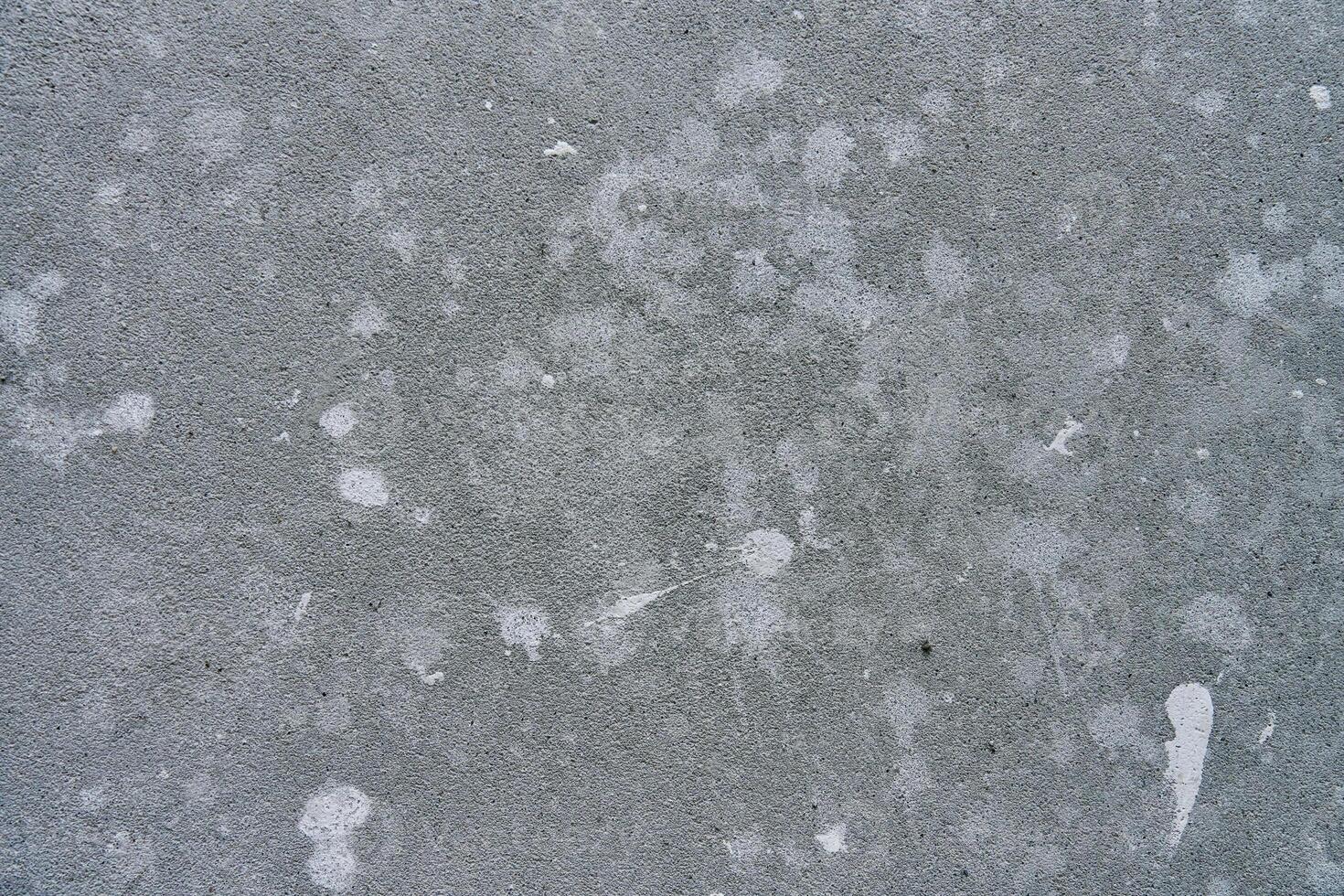 Concrete wall with paint stains. Repair concept photo