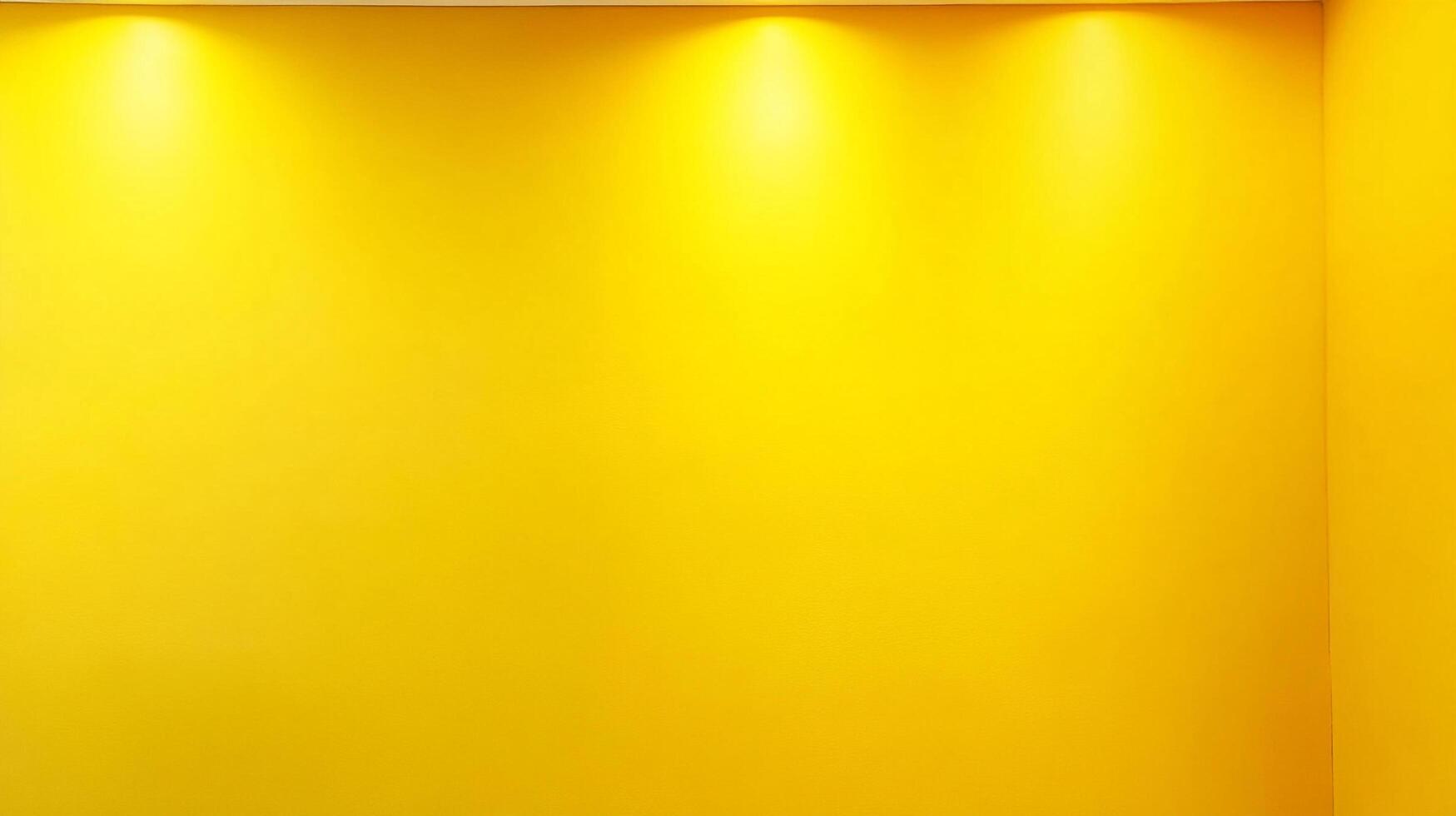 Bright yellow walls illuminated by concealed spotlights create a vibrant and inviting atmosphere. Ideal for showcasing artwork or photography. photo