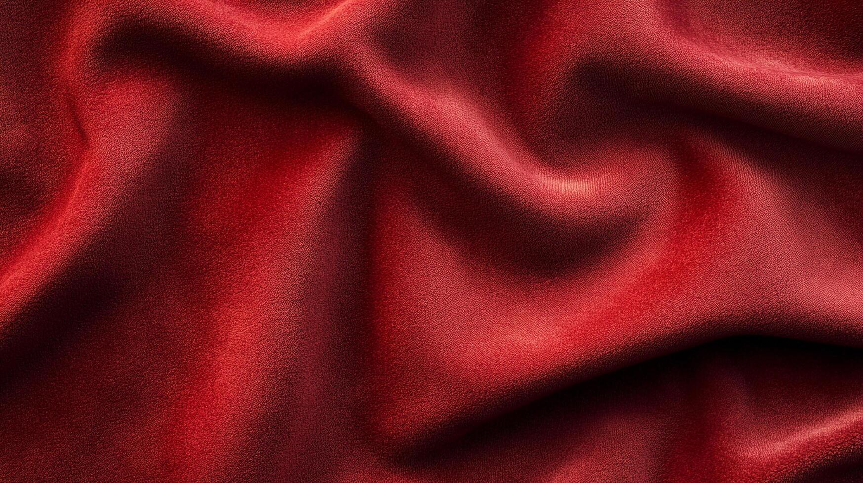An image of a draped textile in dark red tones, displaying soft textures and shadow play for a tactile sensory experience. photo