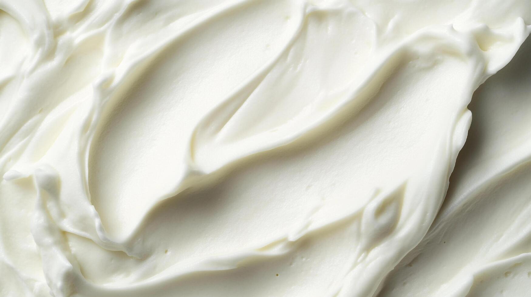 Smooth swirls of creamy delight, a velvety texture that invites indulgence and pure, white allure in every delectable curve. photo