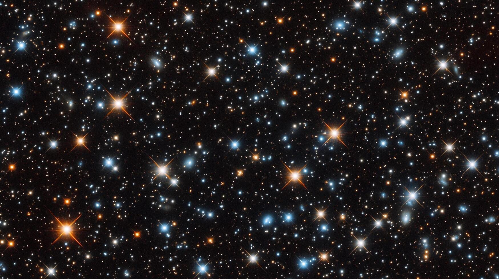 A mesmerizing view of a star-studded cosmos, celestial gems sparkling in the inky void. Shimmering points of light paint the darkness. photo