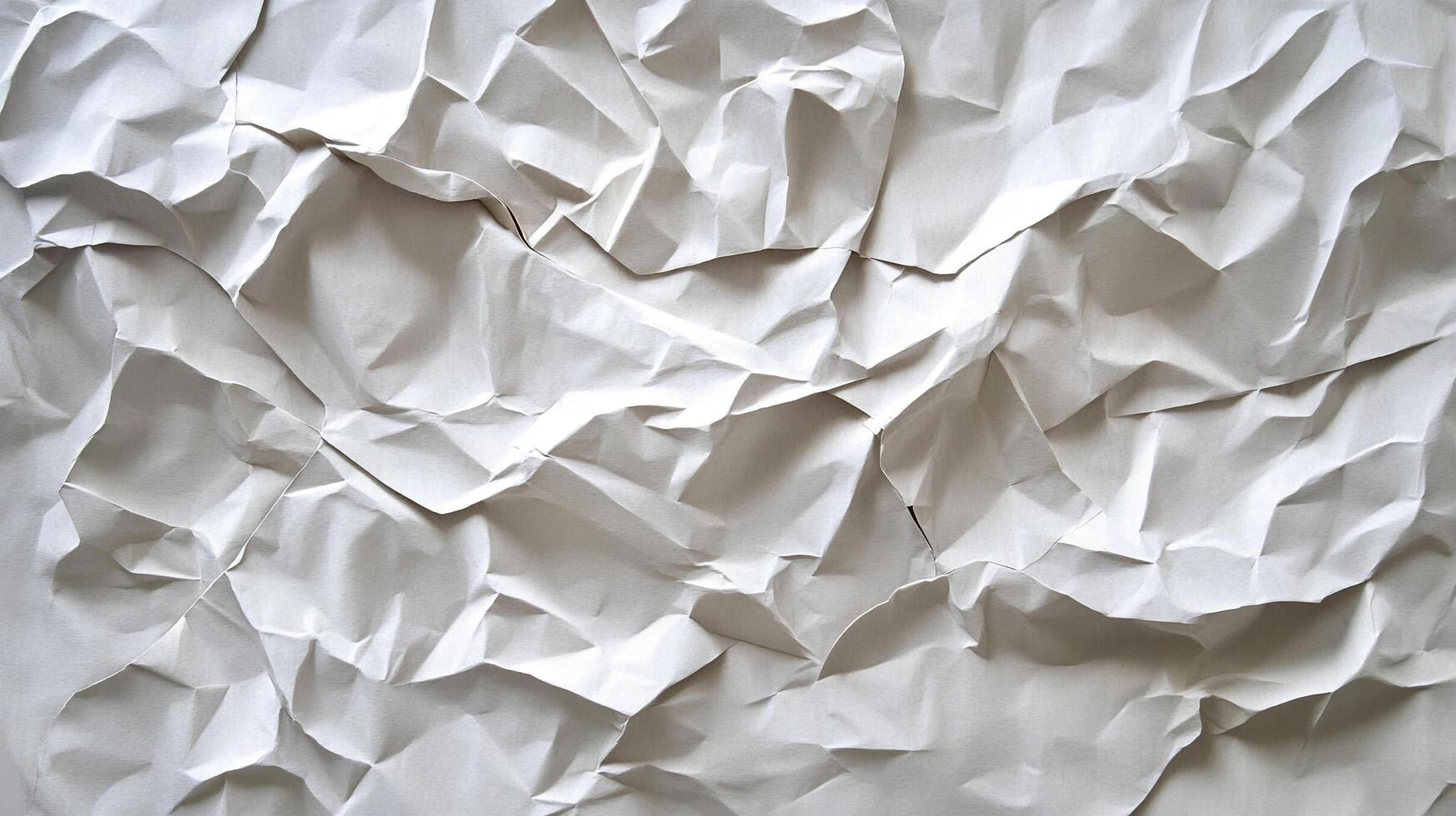 Dramatic and abstract view featuring crumpled paper with multiple layers. This composition showcases texture and contrast created by light. photo